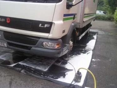 Commercial lorry cleaned on a contained wash mat Specialist vehicle washing process showing commercial lorry cleaned on a contained wash mat to manage wastewater within an industrial environment, Eastleigh Hampshire