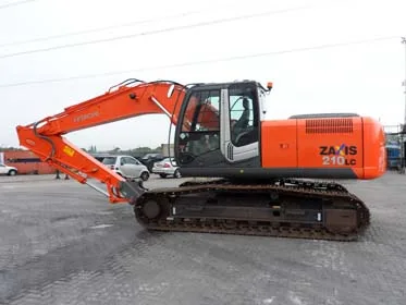 Construction excavator following specialist professional cleaning Construction excavator following specialist professional cleaning, positioned in a commercial yard to illustrate plant maintenance and site operations, Eastleigh Hampshire