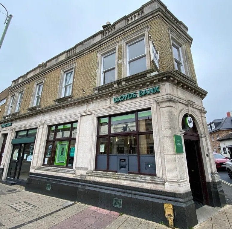 Exterior of former Lloyds Bank building on a high street corner showing traditional commercial property façade